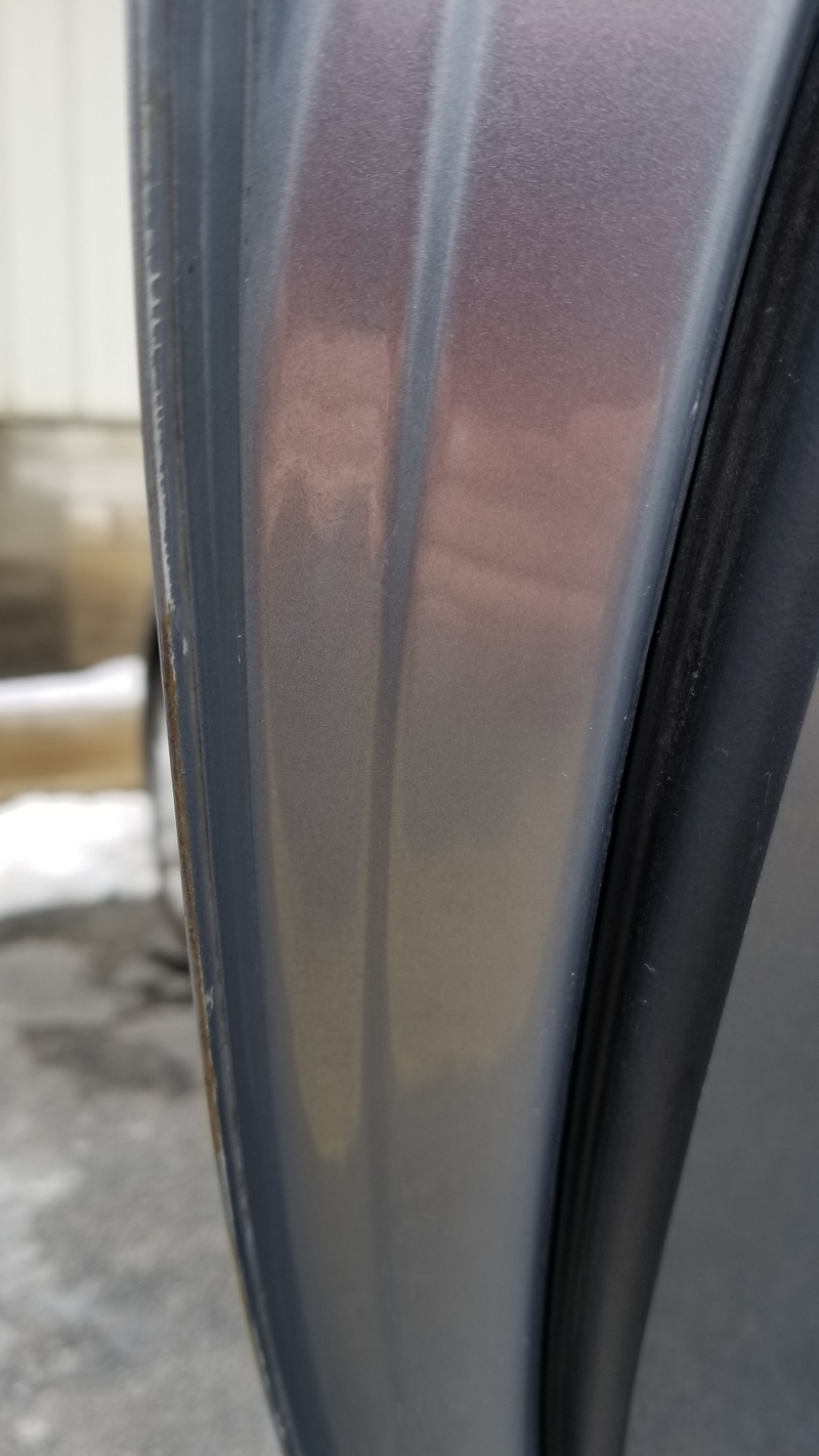 Rear driver’s side door edge.